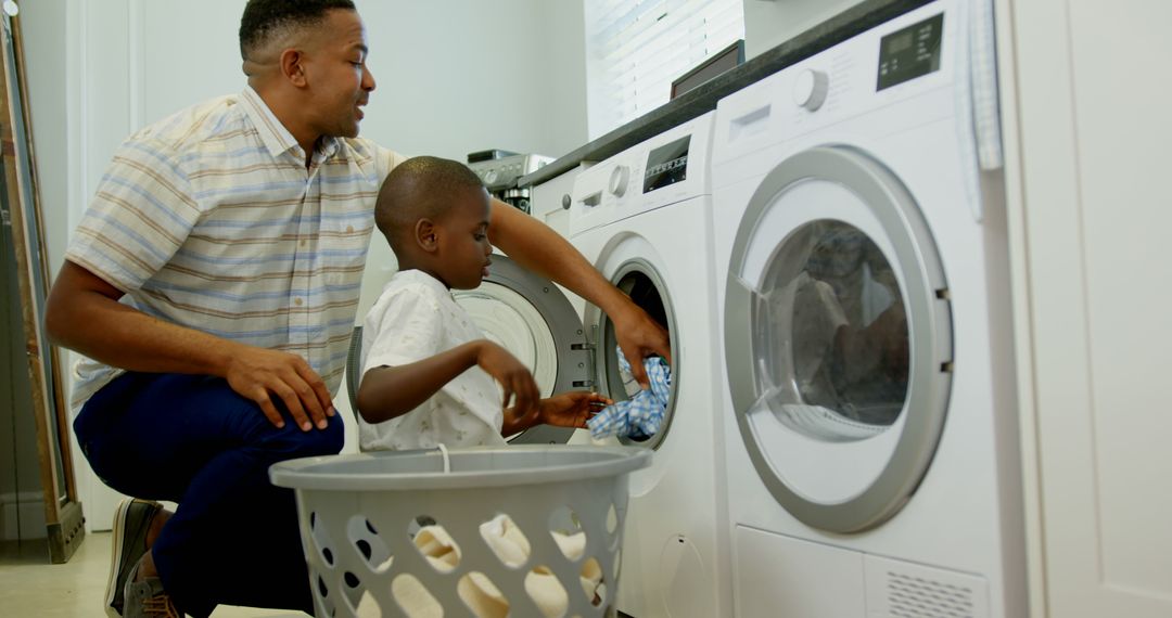 Father and Son Doing Laundry Together in Modern Laundry Room - Free Images, Stock Photos and Pictures on Pikwizard.com