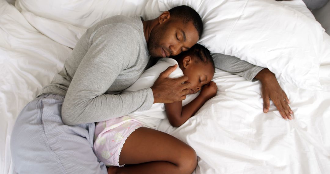 Father and daughter sleeping peacefully in bed morning - Free Images, Stock Photos and Pictures on Pikwizard.com