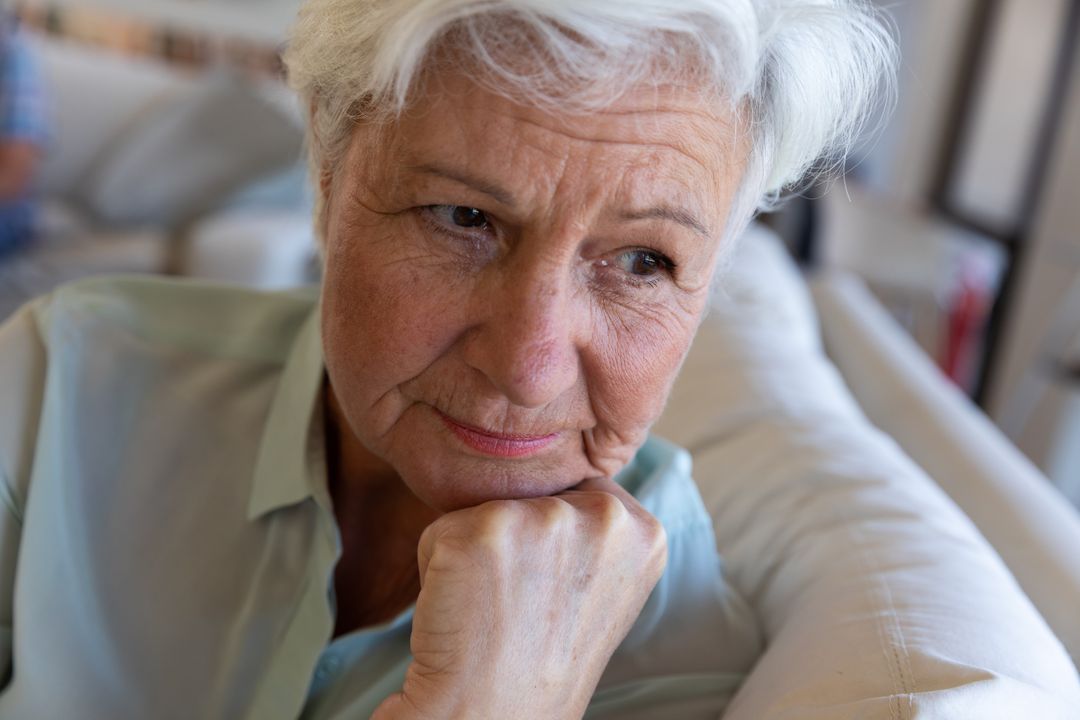 Close up of senior caucasian woman sitting on the couch at home - Free Images, Stock Photos and Pictures on Pikwizard.com