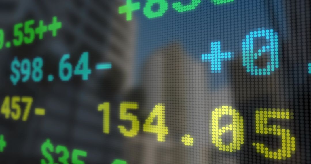 LED Ticker Displaying Currency Symbols and Numbers in Financial District