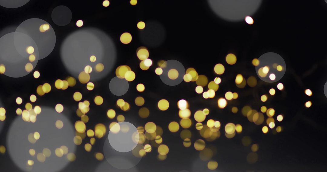 Golden Bokeh Sparkle over Dark Background