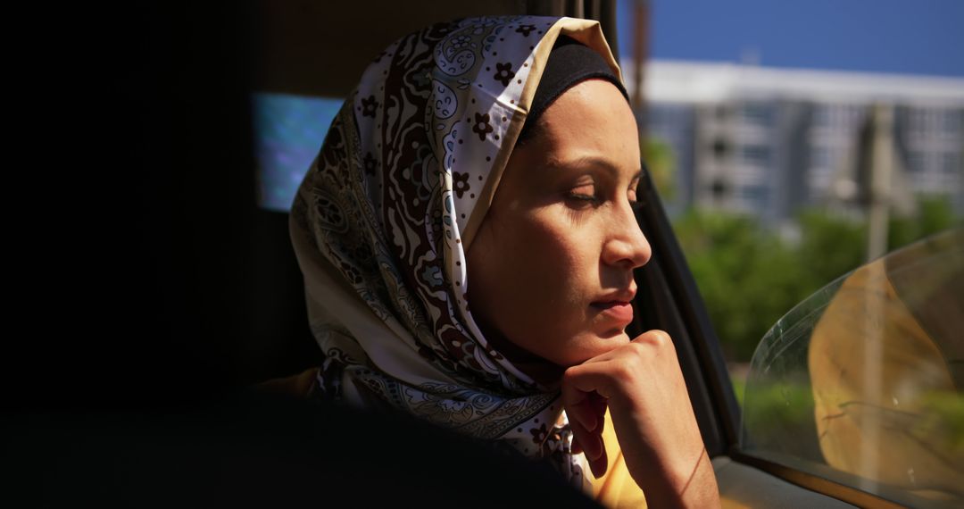 Peaceful Young Woman in Headscarf Enjoying Sunlight - Free Images, Stock Photos and Pictures on Pikwizard.com