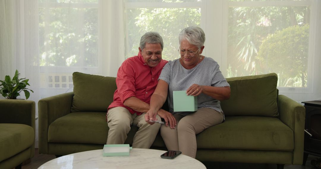Elderly Couple Enjoying Cherished Photo at Home
