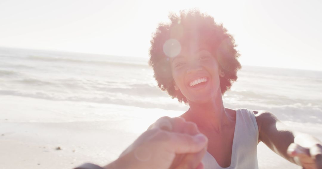 Joyful Woman Enjoying Relaxing Beach Day in Sunlight