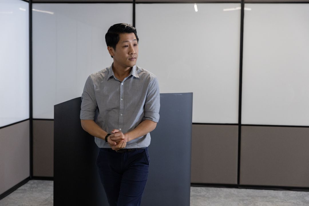 Modern Office Environment with Professional Leaning on Partition