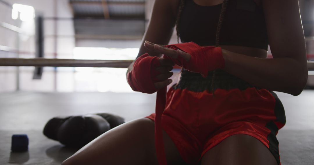 Female Boxer Wrapping Hands Before Training in Boxing Gym - Free Images, Stock Photos and Pictures on Pikwizard.com