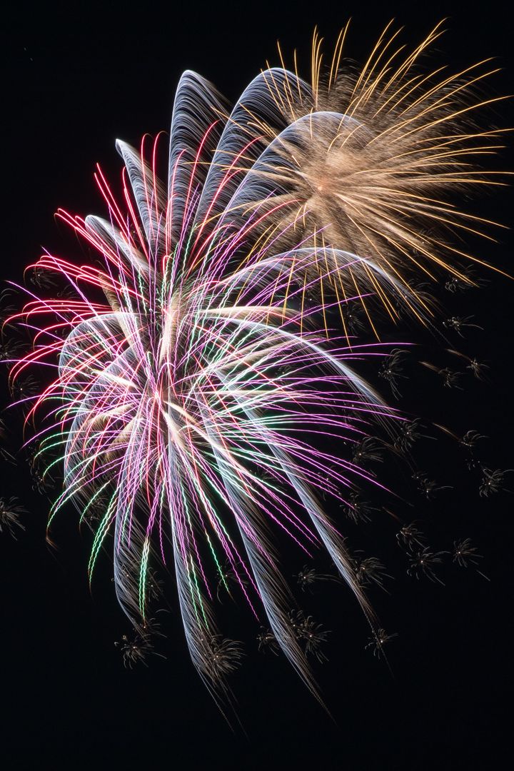 Colorful Fireworks Exploding in Night Sky During Festive Event - Free Images, Stock Photos and Pictures on Pikwizard.com