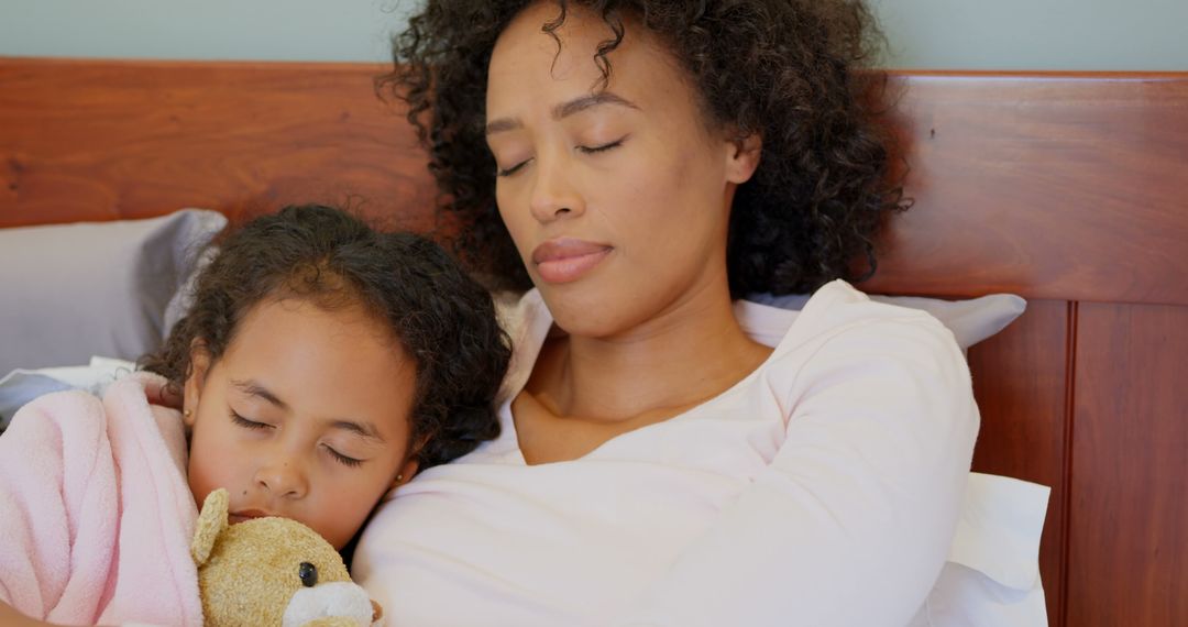 Peaceful Sleep for Mother and Daughter with Teddy Bear