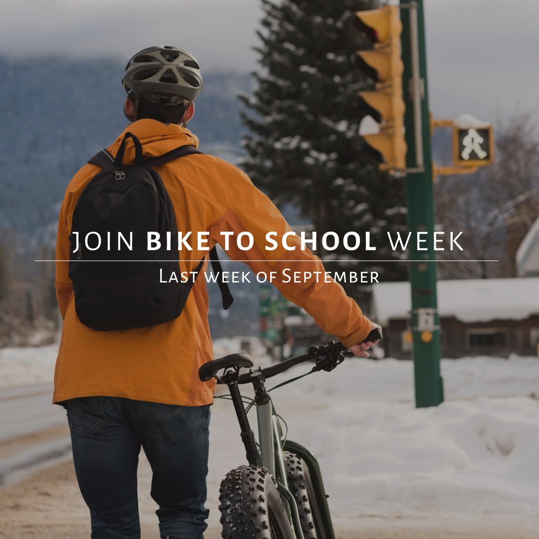 Student Promoting 'Bike to School Week' in Snowy Neighborhood