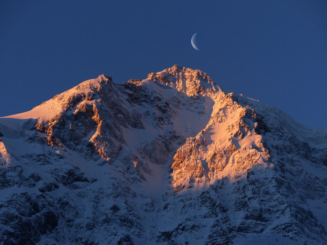 Crescent Moon over Snow Mountain - Free Images, Stock Photos and Pictures on Pikwizard.com