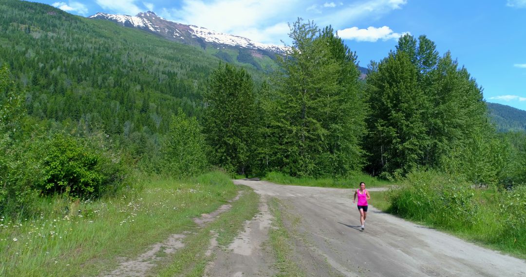 Woman jogging on a scenic mountain trail, with copy space - Free Images, Stock Photos and Pictures on Pikwizard.com