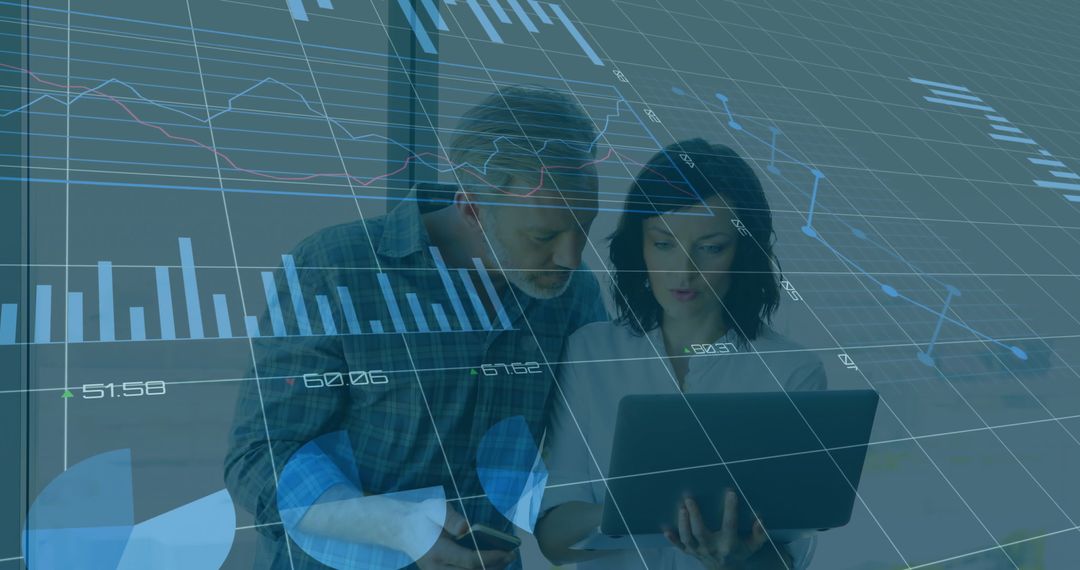 Business Colleagues Analyzing Financial Data with Overlay of Graphs