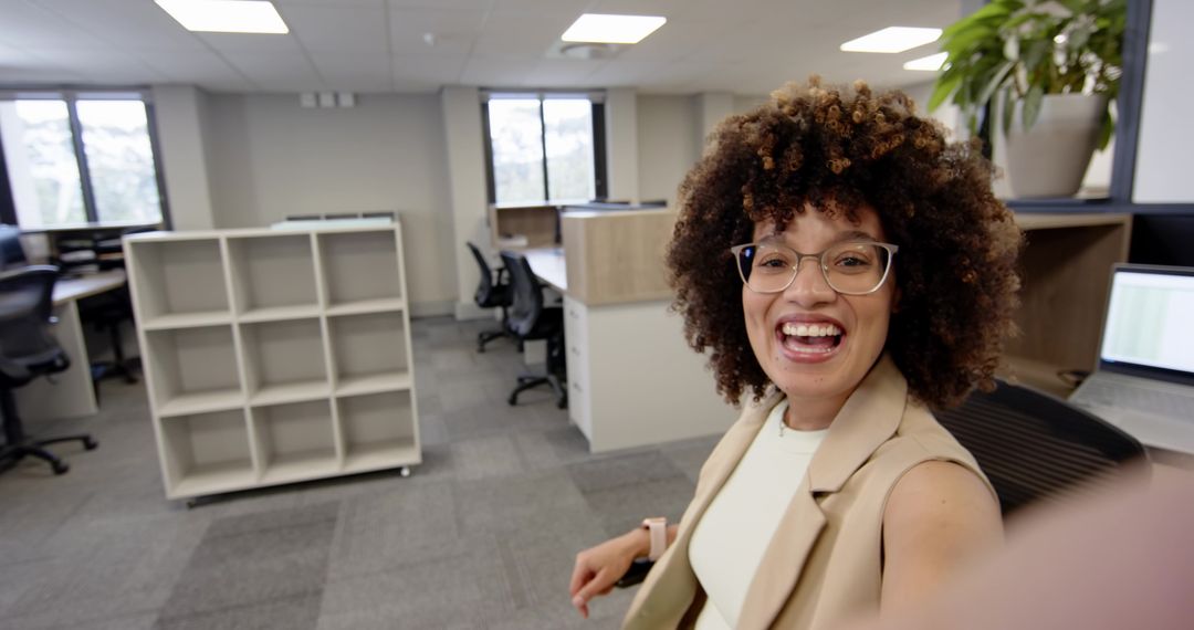 Smiling Woman Enjoying Break in Modern Office Space