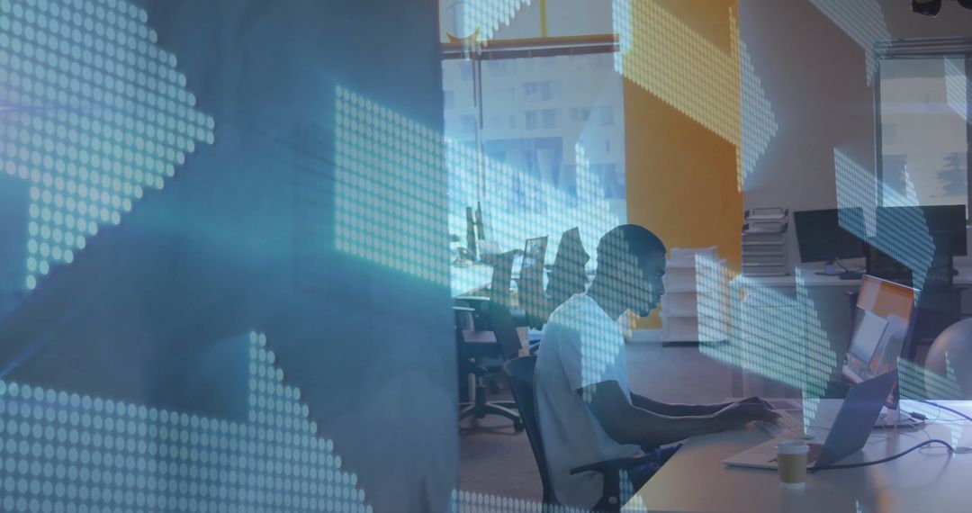 Silhouette of Man Working Amidst Arrow Graphics in Modern Workplace