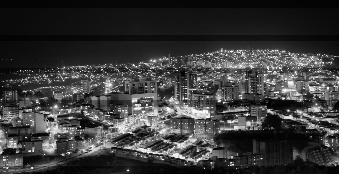 Panoramic Night View of Cityscape Illuminated by City Lights - Free Images, Stock Photos and Pictures on Pikwizard.com