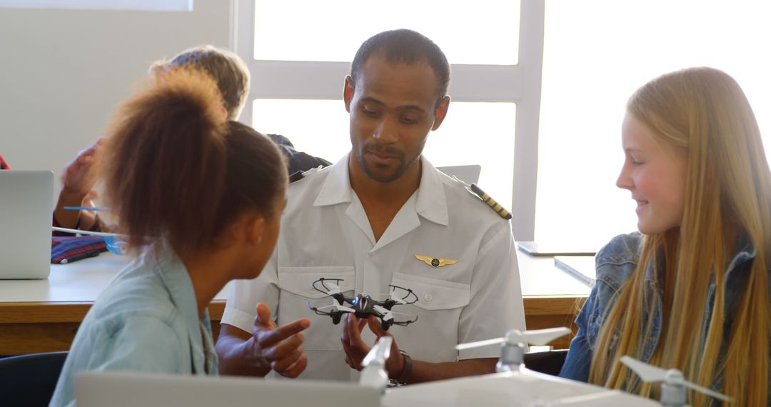 Pilot Demonstrating Drone to Diverse Students in Classroom - Free Images, Stock Photos and Pictures on Pikwizard.com