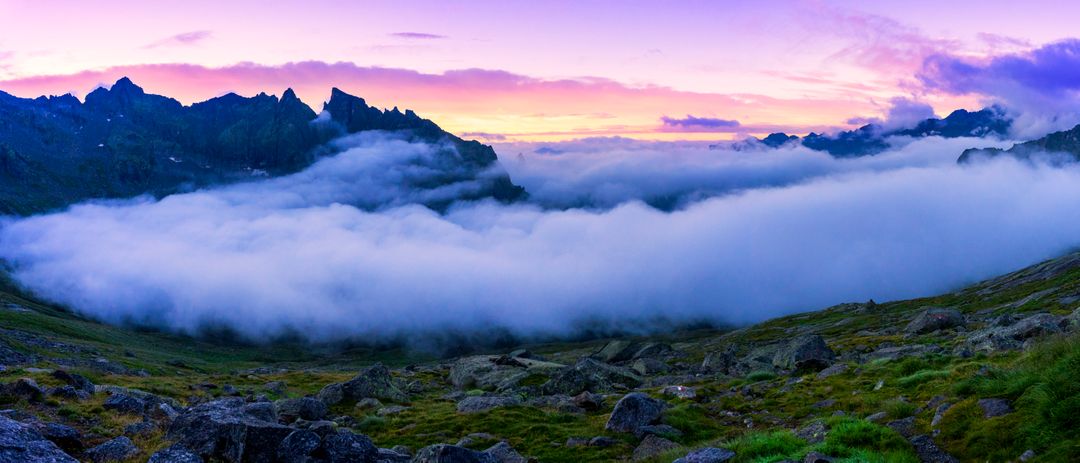 Panoramic Mountain View with Vibrant Sunset and Layer of Clouds - Free Images, Stock Photos and Pictures on Pikwizard.com