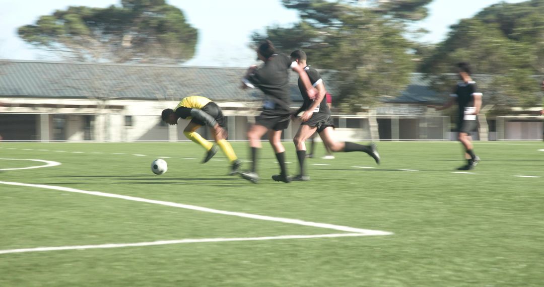 Enthusiastic Soccer Players Practicing Teamwork on Field