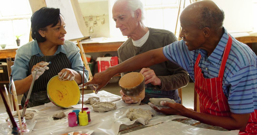 Seniors Engaging in Pottery Class at Community Center - Free Images, Stock Photos and Pictures on Pikwizard.com
