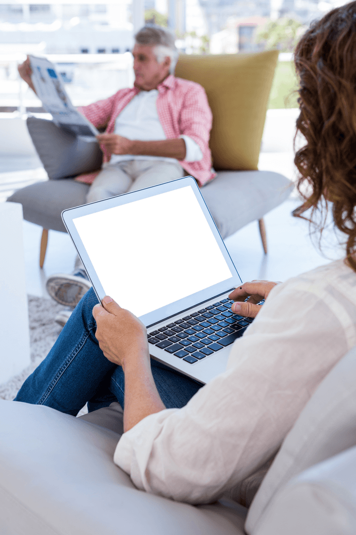 Woman Using laptop at Home with Blank Screen Displayed for Transparent Communication