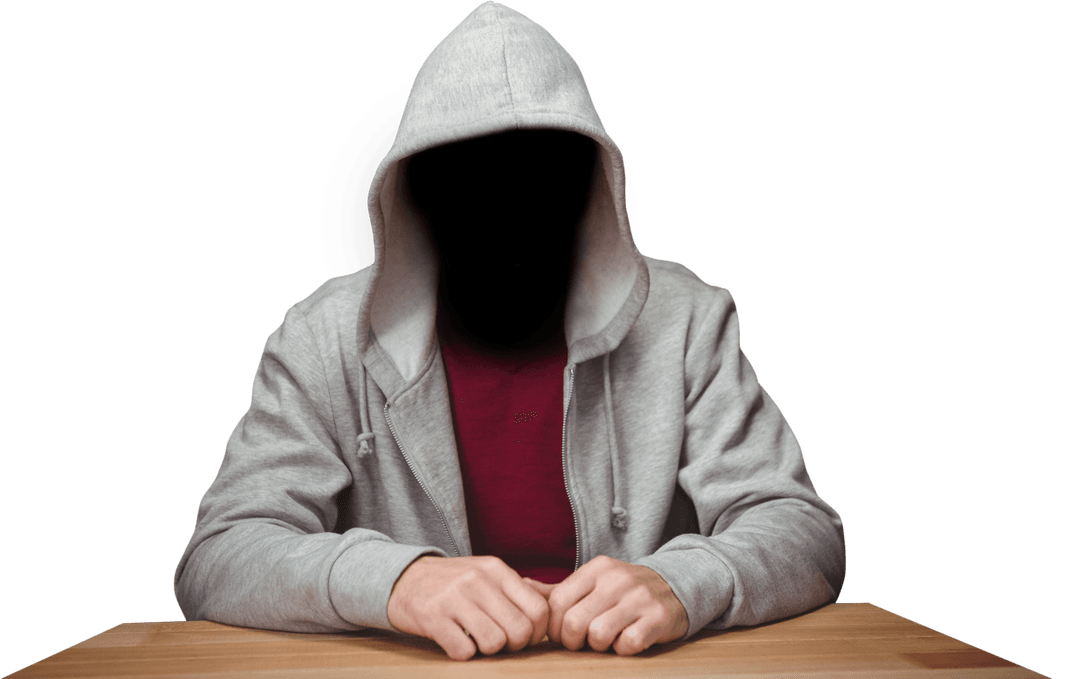 Hooded Figure in Gray Attire Sitting at Wooden Table Transparent Background