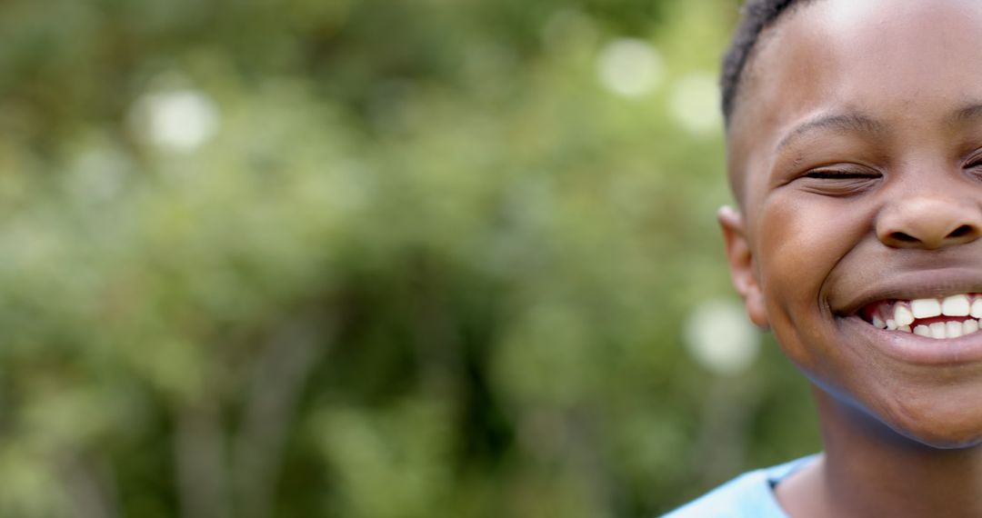 Joyful Child Laughing Outdoors in Nature