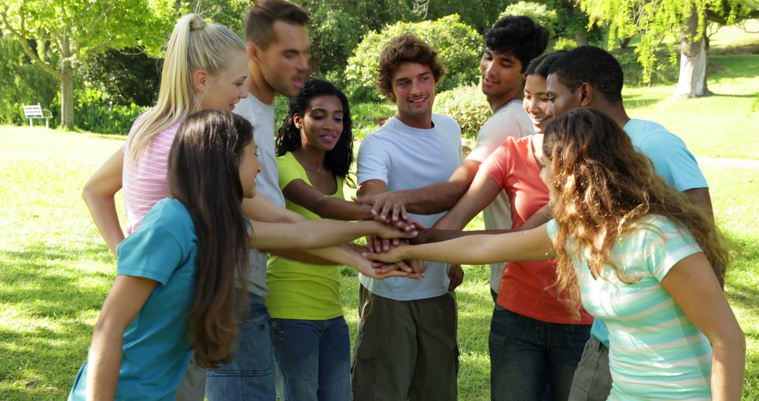 Diverse Group of Friends in Park Forming Unity Circle - Free Images, Stock Photos and Pictures on Pikwizard.com