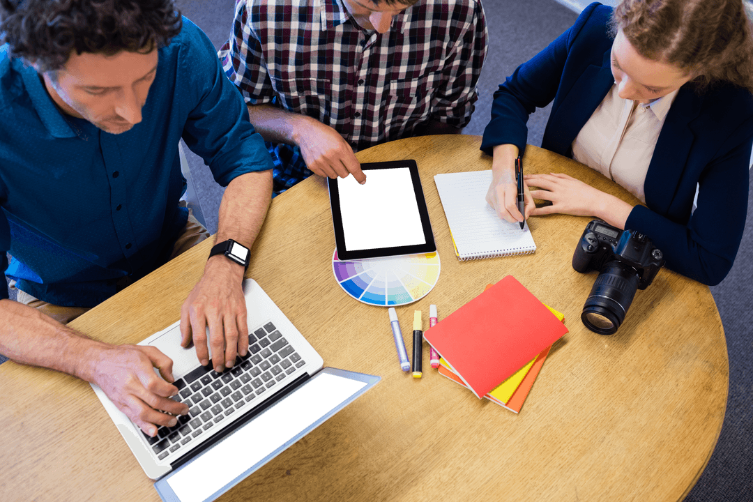 Team Collaborating with Digital Devices on Transparent Project