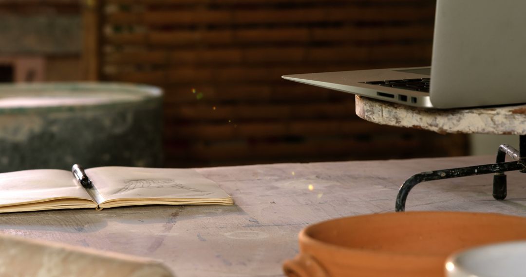 Creative Pottery Workshop with Laptop and Sketchbook