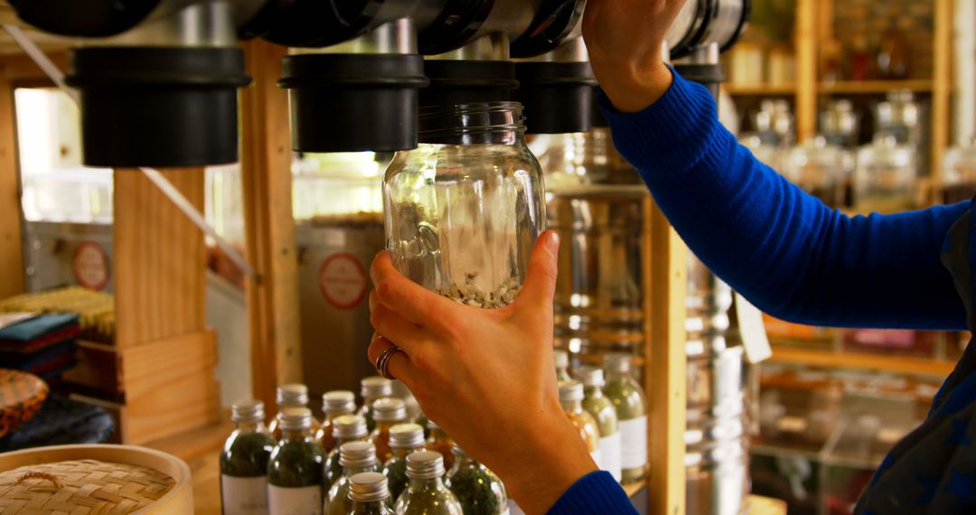 Woman Filling Reusable Jar with Grains from Zero Waste Store Dispenser - Free Images, Stock Photos and Pictures on Pikwizard.com