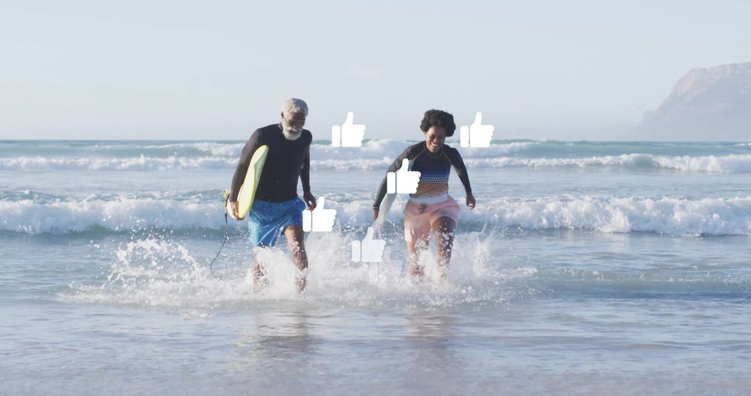 Active Seniors Running with Surfboard in Ocean