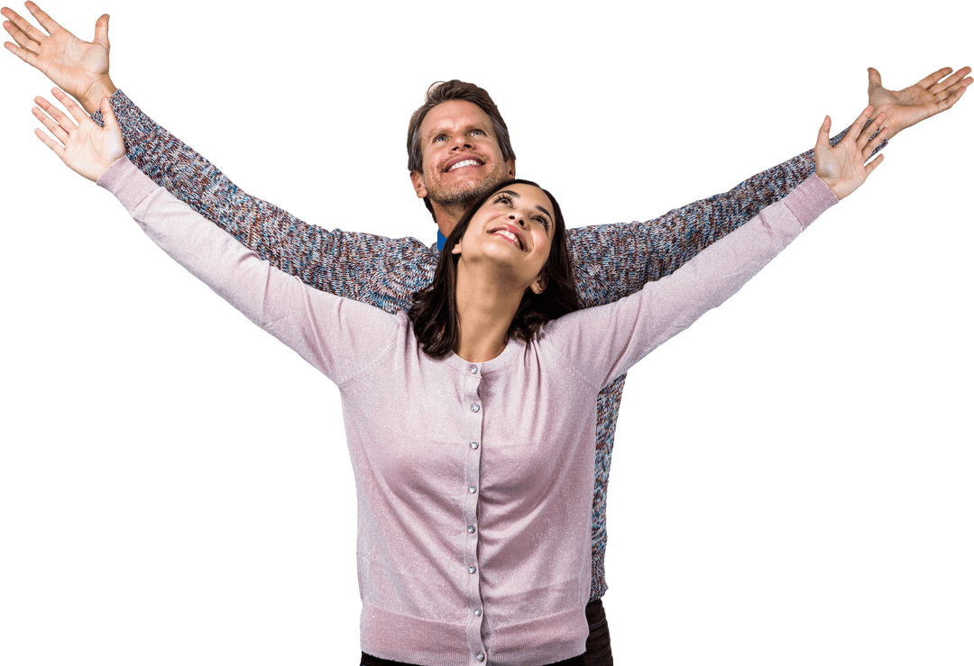 Joyful Couple Celebrating with Arms Raised Smiling Naturally