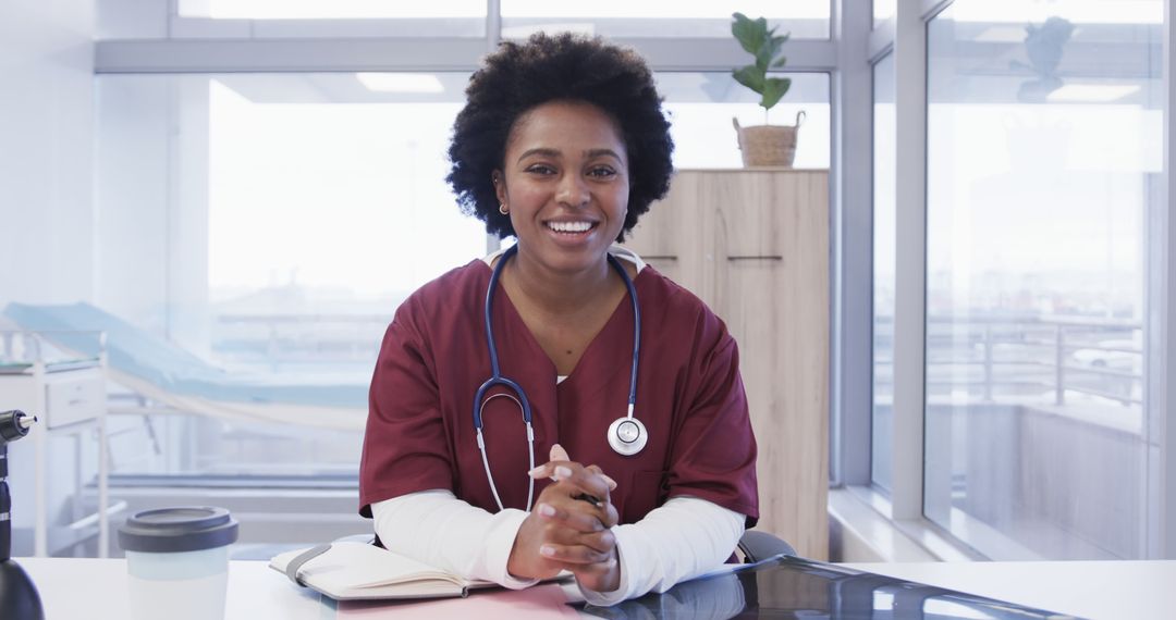 Smiling African American Female Nurse in Hospital Office with Stethoscope - Free Images, Stock Photos and Pictures on Pikwizard.com