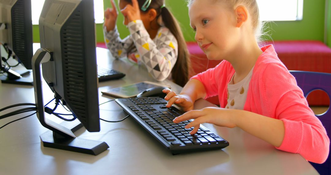 Diverse Schoolgirls Engaged in Computer Learning