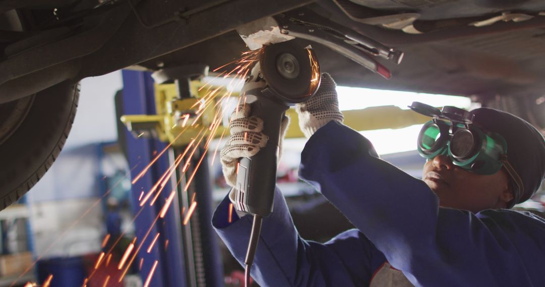 Auto Mechanic Welding Under Car - Free Images, Stock Photos and Pictures on Pikwizard.com