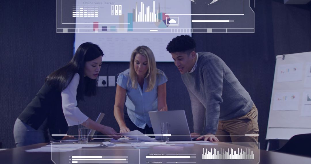 Business Team Analyzing Data with Interactive Charts in Modern Office