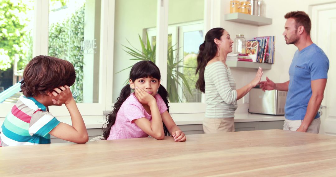 Parents Arguing While Children Look Unhappy in Kitchen - Free Images, Stock Photos and Pictures on Pikwizard.com