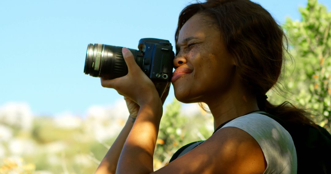 Female Photographer Capturing Nature Shots Outdoors - Free Images, Stock Photos and Pictures on Pikwizard.com