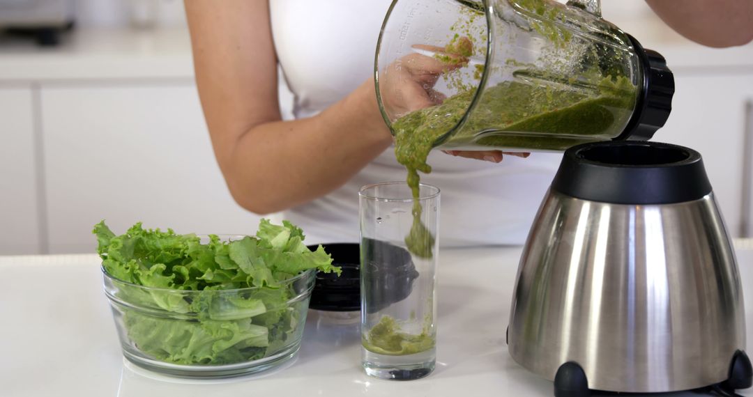 Person Making Fresh Vegetable Smoothie with a Blender - Free Images, Stock Photos and Pictures on Pikwizard.com