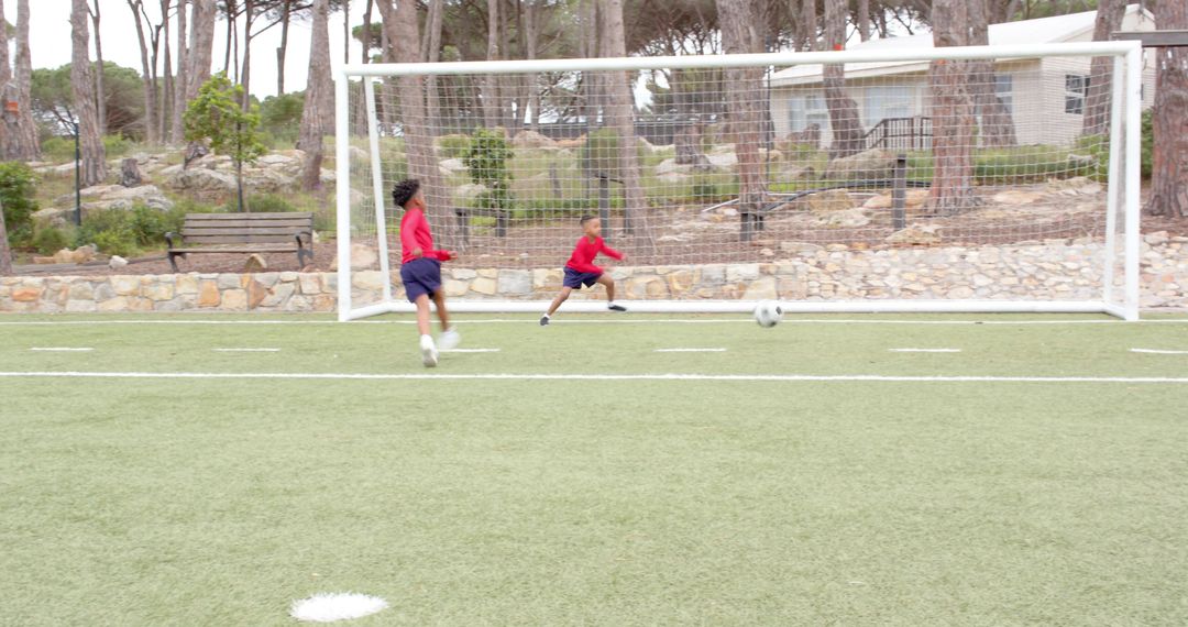 Young Soccer Team Practicing on Turf Field with Determination