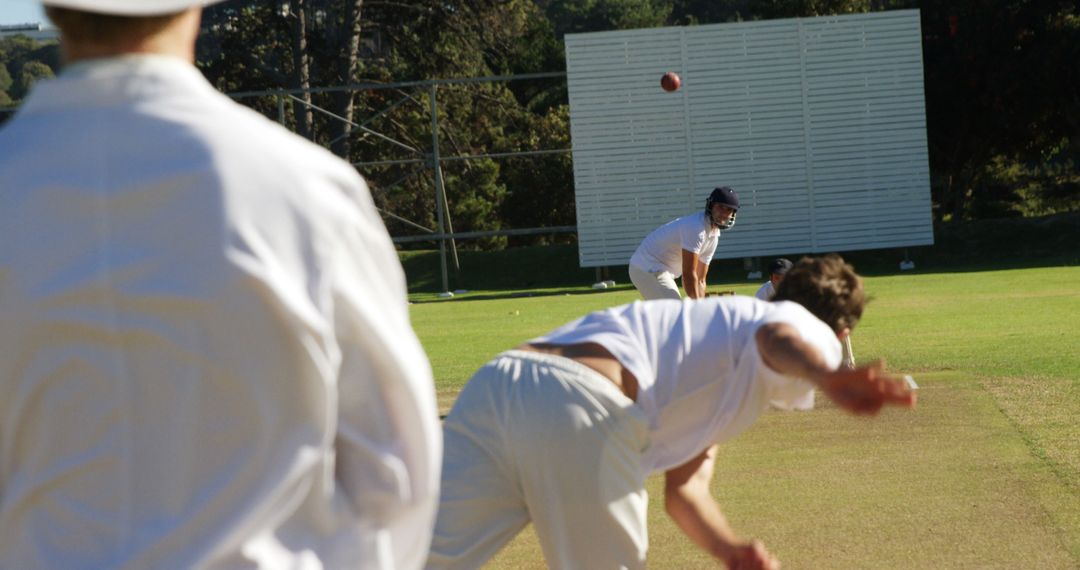 Cricketer Bowler Performing Role During Outdoor Match on Sunny Day - Free Images, Stock Photos and Pictures on Pikwizard.com