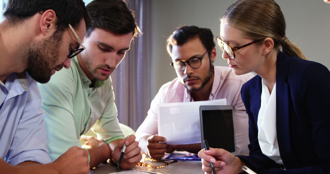 Focused Business Team Collaborating in Modern Office