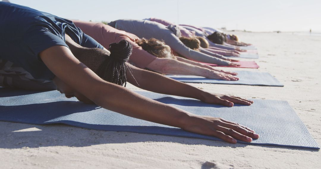 Group Practicing Yoga on Beach - Free Images, Stock Photos and Pictures on Pikwizard.com