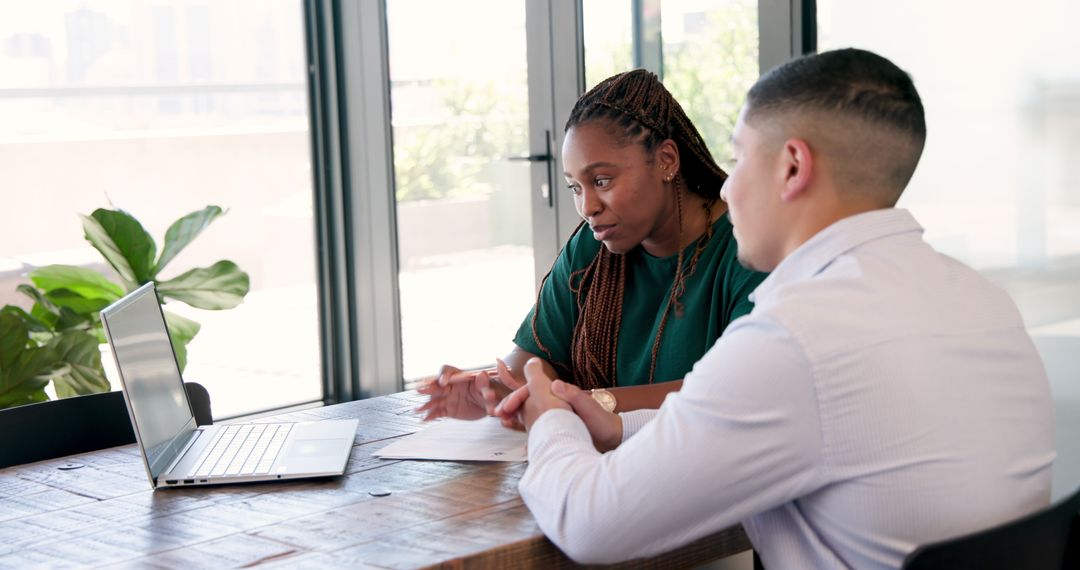 Diverse Colleagues in Collaborative Office Discussion Meeting