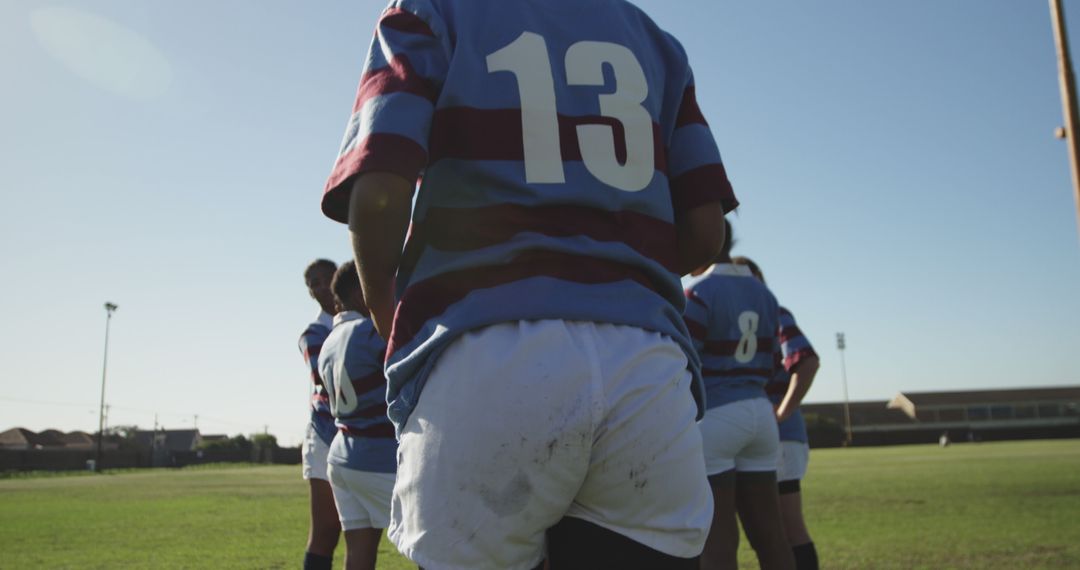 Close-up of Rugby Team Preparing on Field Under Clear Sky - Free Images, Stock Photos and Pictures on Pikwizard.com