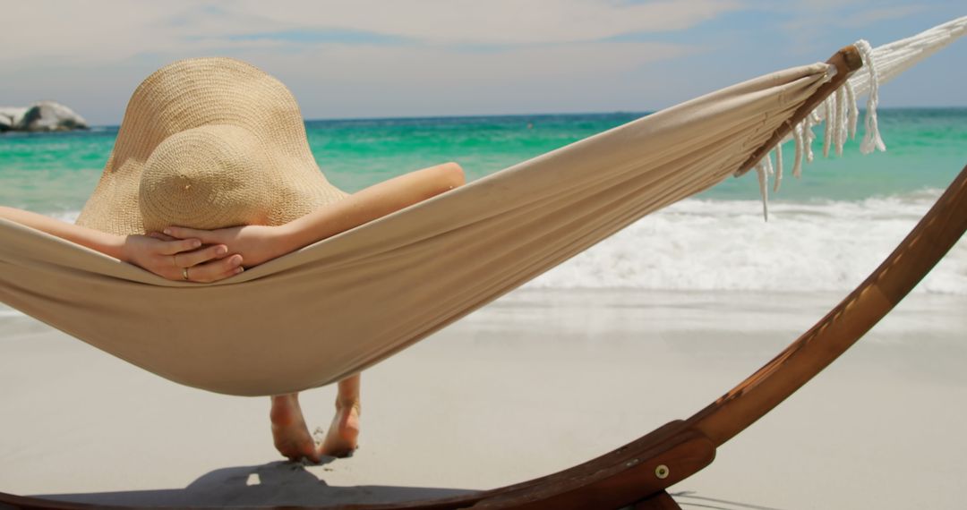Woman Relaxing on Beach Hammock with Ocean View