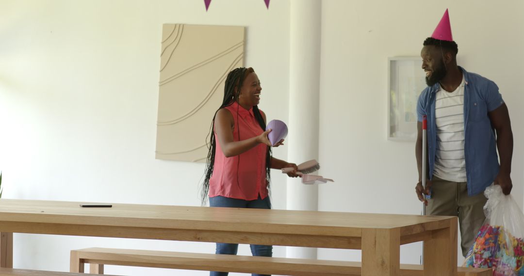 Family Celebrating Event at Home with Laughter and Joy