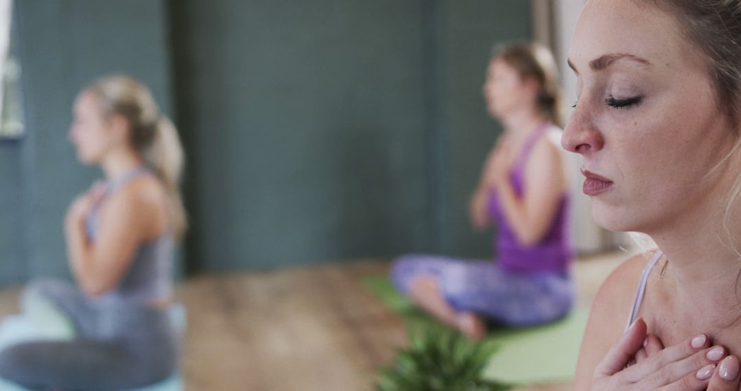 Group of Women Meditating Together in Peaceful Indoor Setting - Free Images, Stock Photos and Pictures on Pikwizard.com