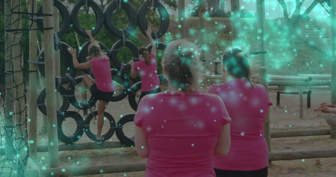 Women Conquering Obstacle Course in Team Challenge Event