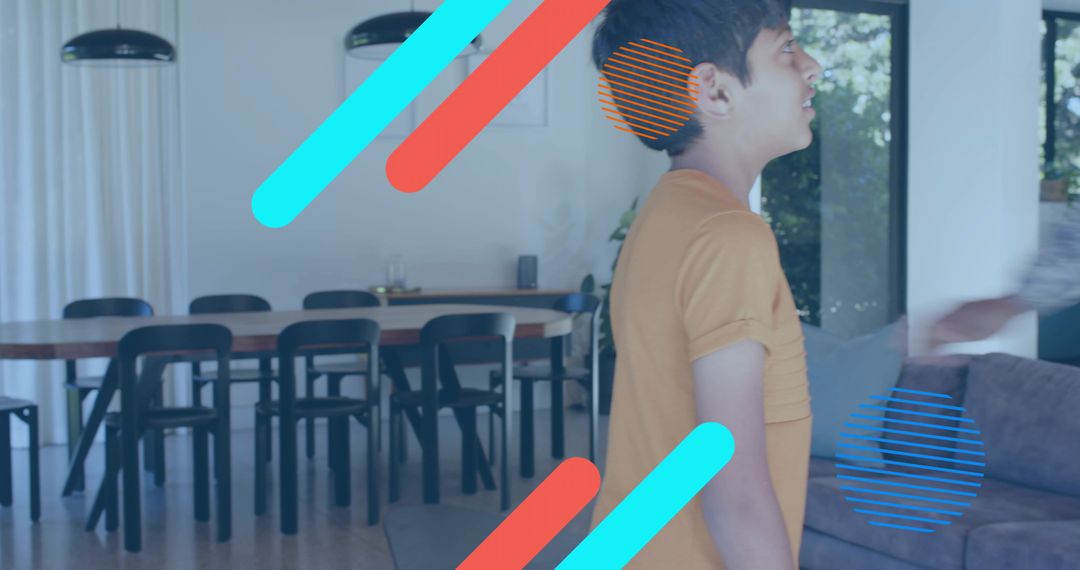 Standing boy in orange t-shirt looking right in modern open-plan living room